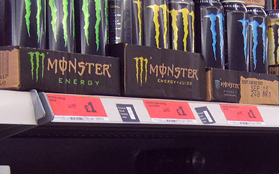 Monster energy drinks on a shelf in a store